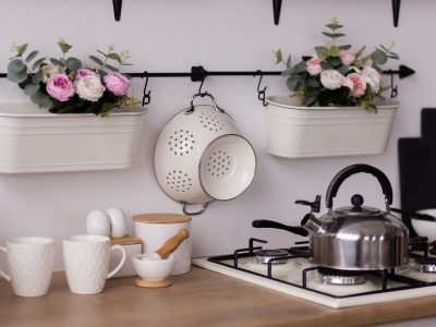 Stainless steel kettle on stove with flowers