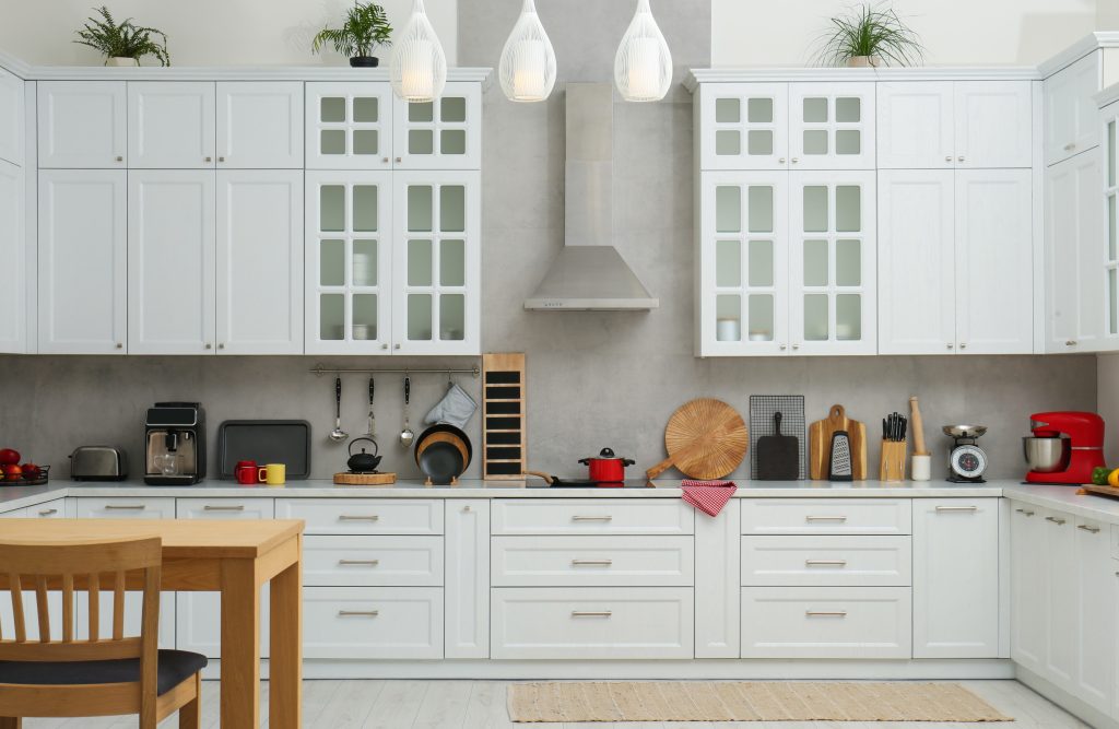 White kitchen with utensils and appliances