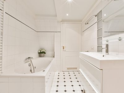 White bathroom with bathtub and sink