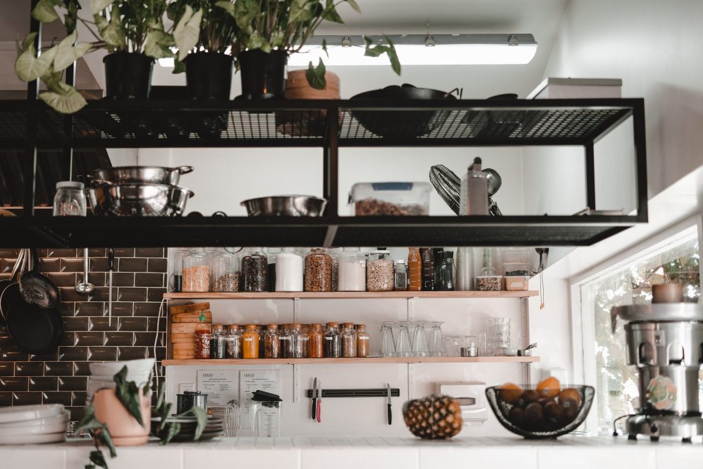 Kitchen shelves with jars and fruit bowl