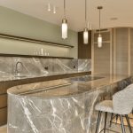 Marble kitchen island with pendant lights