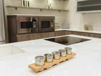 Spice rack on white kitchen countertop