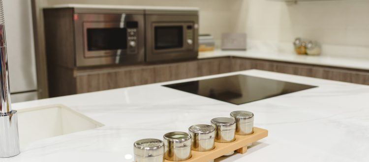 Spice rack on white kitchen countertop