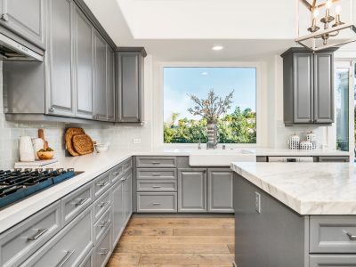 Gray kitchen cabinets with window view