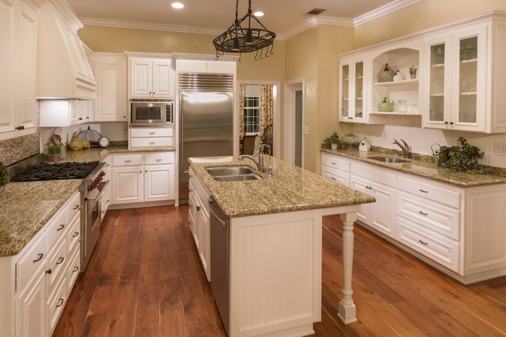 granite countertop kitchen with white cabinets